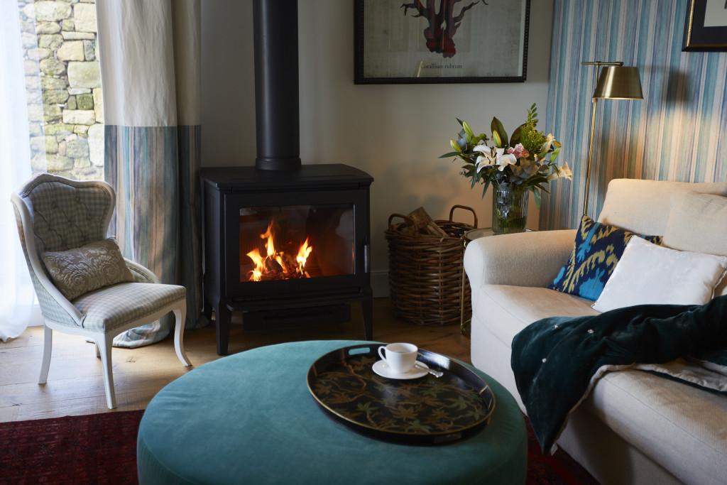 Experience an intimate living room and a cosy fireplace